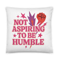 Typography with red raised fist and text 'Not Aspiring to Be Humble' Pillow front view — Wandering With Pride