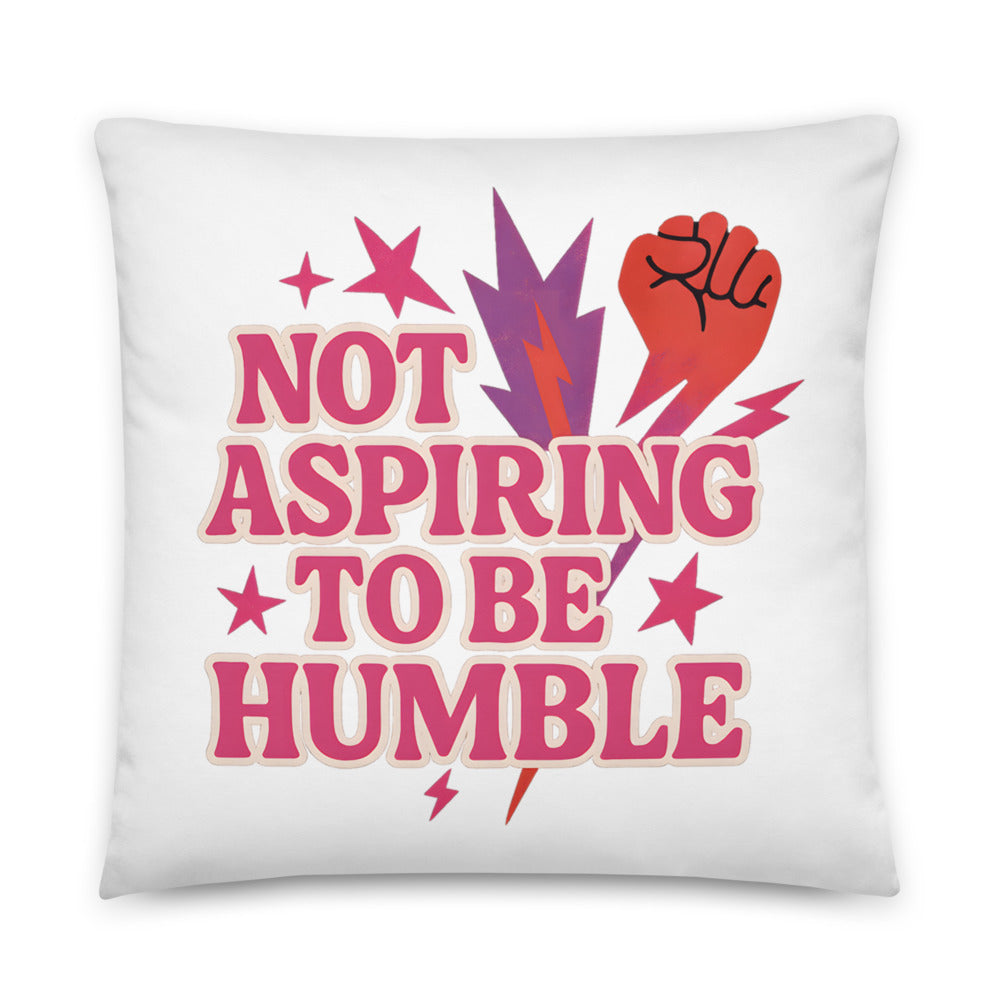 Typography with red raised fist and text 'Not Aspiring to Be Humble' Pillow front view — Wandering With Pride