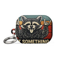 vintage-style cartoon raccoon in 'rock on' gesture with 'UNDIAGNOSED' and 'BUT SOMETHING AIN'T RIGHT' text AirPods Case front view — Wandering With Pride