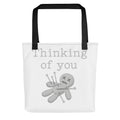 voodoo doll with pins and 'Thinking of you' text Tote Bag front view — Wandering With Pride
