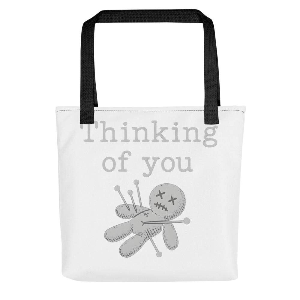 voodoo doll with pins and 'Thinking of you' text Tote Bag front view — Wandering With Pride