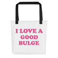 Typography design reading 'I LOVE A GOOD BULGE' in bold pinkish-red text on black background Tote Bag front view — Wandering With Pride