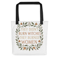 stylized modern Mona Lisa illustration with text 'THEY DIDN'T BURN WITCHES, THEY BURNED WOMEN' Tote Bag front view — Wandering With Pride