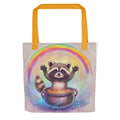 cartoon raccoon emerging from pot of gold with rainbow above Tote Bag front view — Wandering With Pride