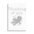 voodoo doll with pins and 'Thinking of you' text Canvas Print front view — Wandering With Pride