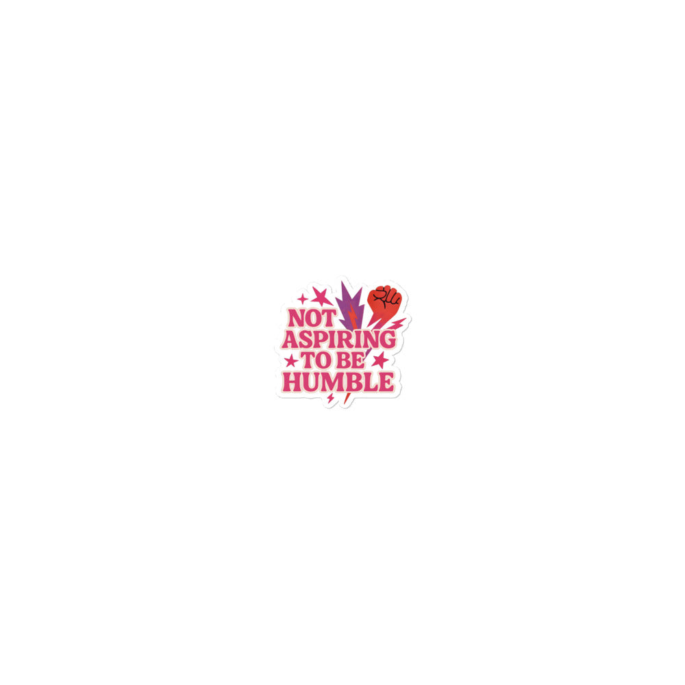Typography with red raised fist and text 'Not Aspiring to Be Humble' Sticker front view — Wandering With Pride