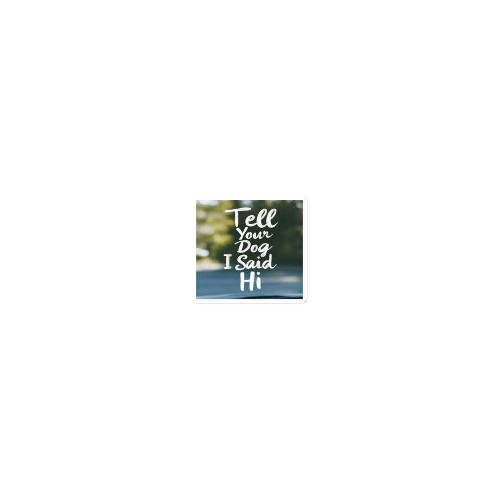 cartoon dog face with speech bubble saying 'Tell Your Dog I Said Hi' Sticker front view — Wandering With Pride