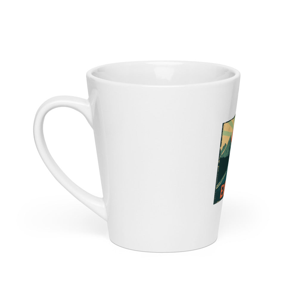 road to mountain range at sunset illustration with 'Explore More' text Latte Mug front view — Wandering With Pride