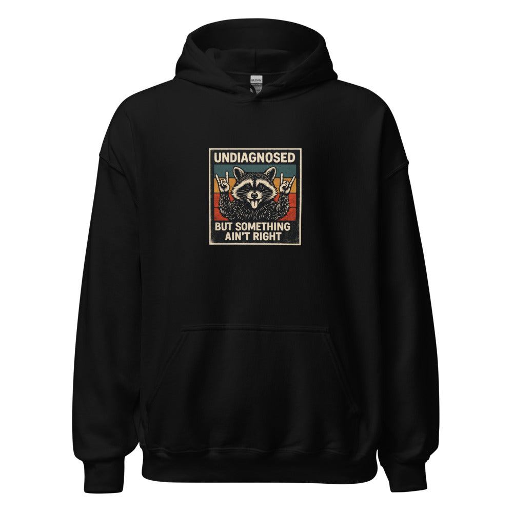 Raccoon illustration with tongue out and paws making peace sign Hoodie front view — Wandering With Pride