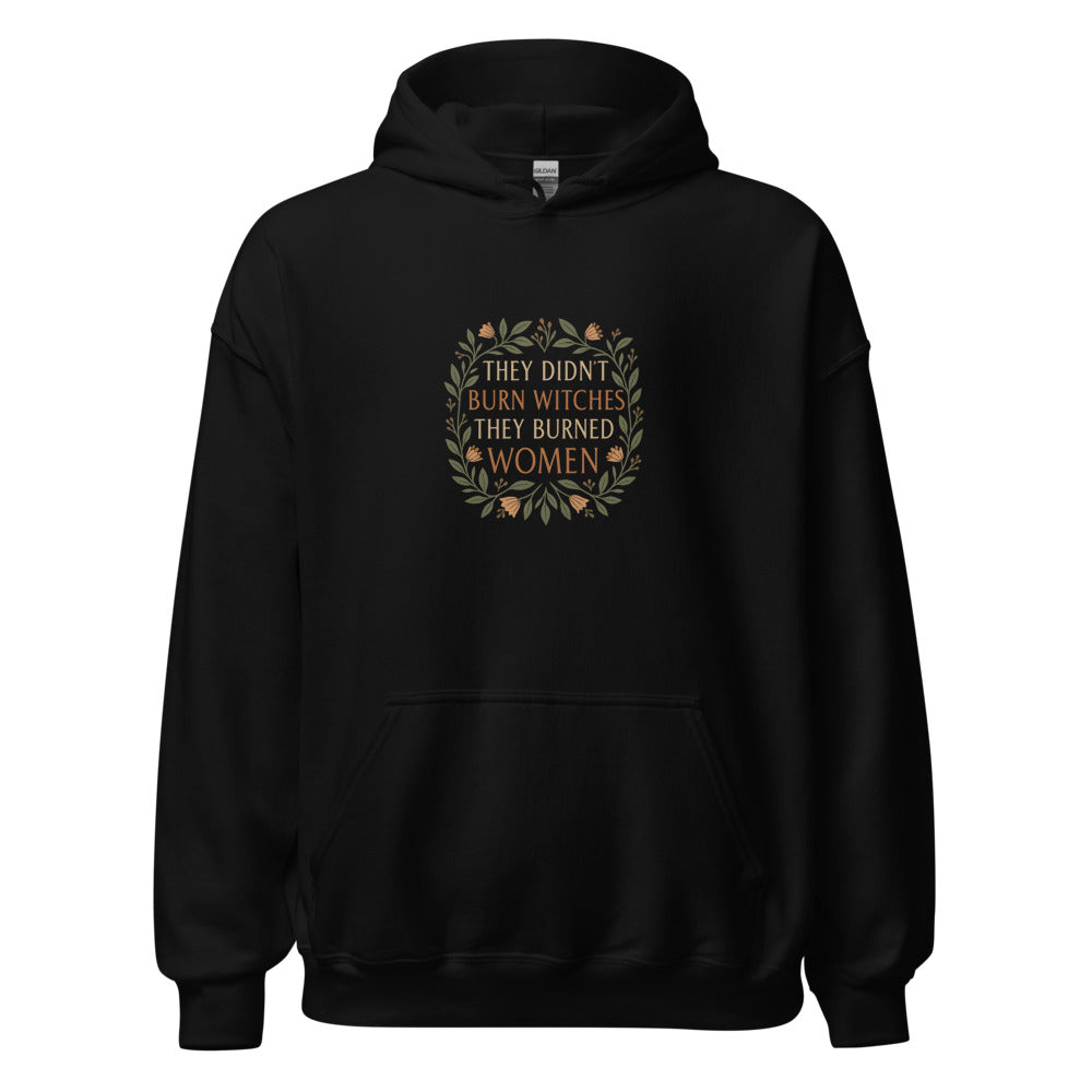 stylized modern Mona Lisa illustration with text 'THEY DIDN'T BURN WITCHES, THEY BURNED WOMEN' Hoodie front view — Wandering With Pride