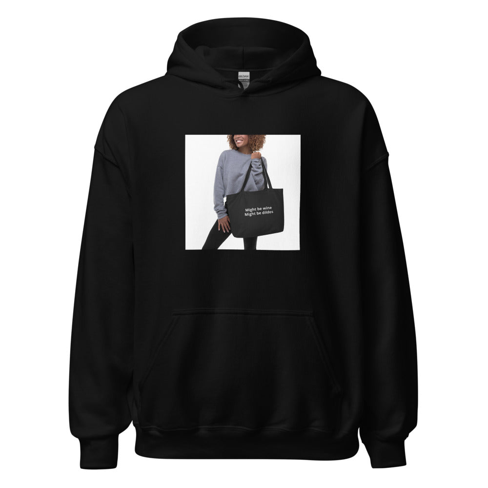 woman holding tote bag with text 'Might be wine. Might be dildes.' Hoodie front view — Wandering With Pride