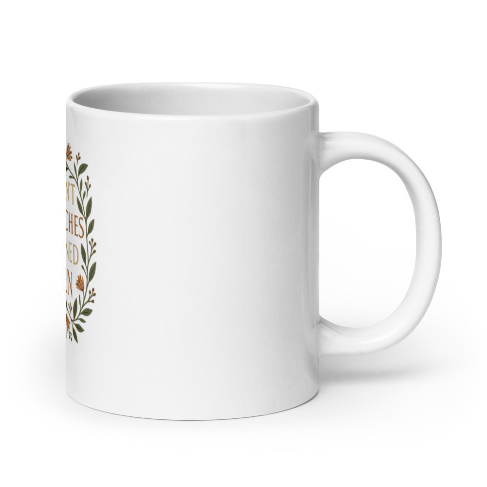 stylized modern Mona Lisa illustration with text 'THEY DIDN'T BURN WITCHES, THEY BURNED WOMEN' 11oz Mug front view — Wandering With Pride